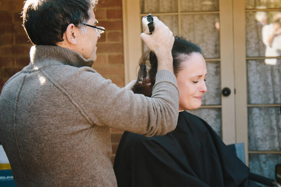 Laura decided to help her two boys come to terms with things by letting them help shave her hair off. Photo: Bows and Ties Photograpgy