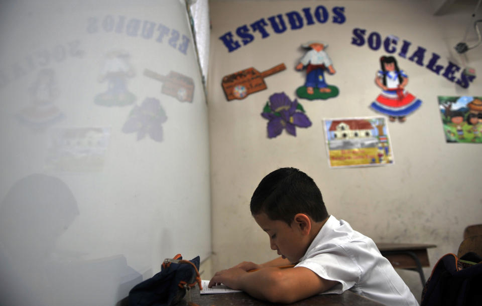 Costa Rican child Gerald Sequeira sits at school in the La Carpio neighborhood of San Jose on June 21, 2013.