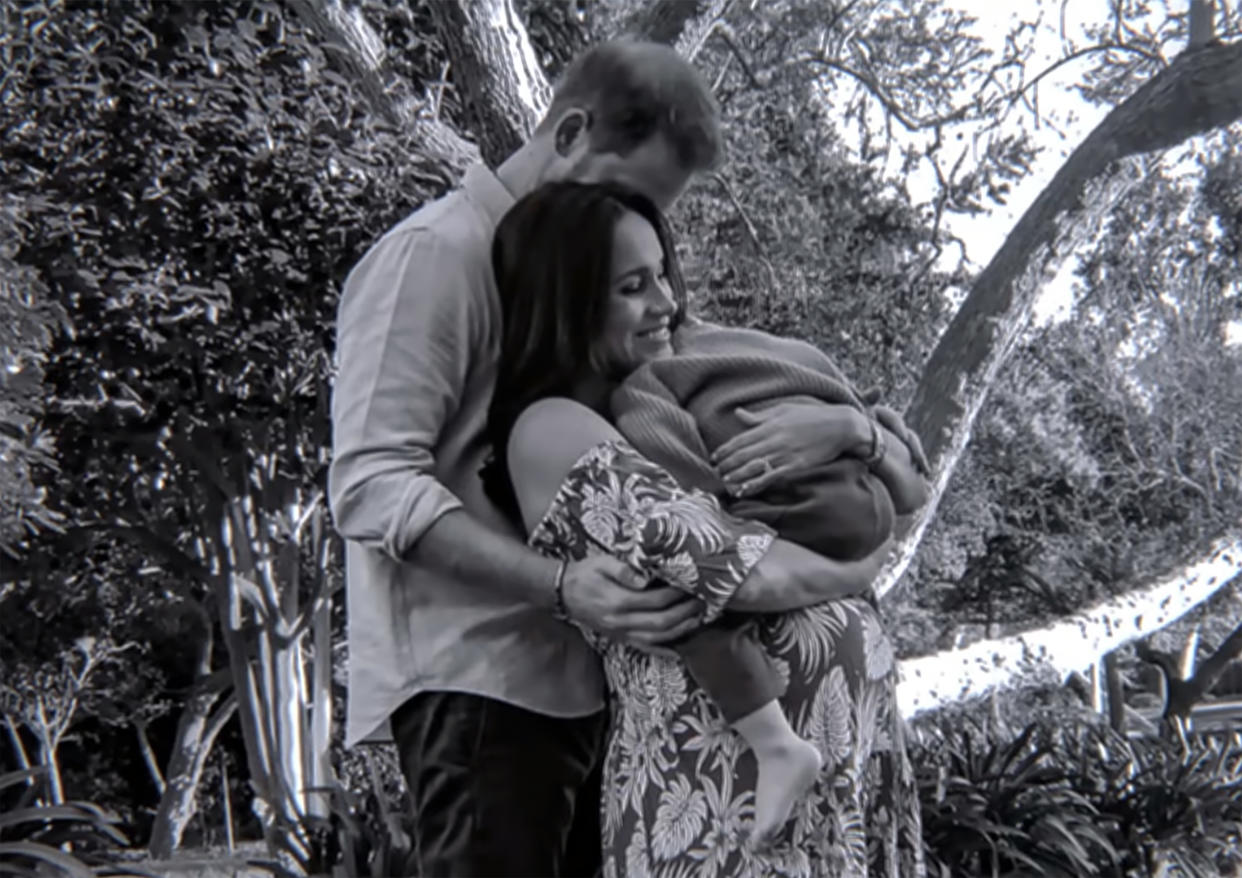 Harry, Meghan and one of their children. (Netflix via YouTube)