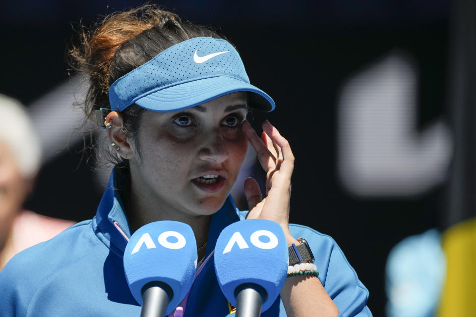 India's Sania Mirza addresses the audience following her mixed doubles final loss with partner Rohan Bopanna to Brazil's Luisa Stefani and Rafael Matos at the Australian Open tennis championship in Melbourne, Australia, Friday, Jan. 27, 2023. (AP Photo/Aaron Favila)