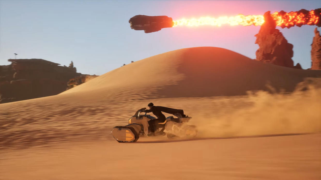  A screenshot from the State of Unreal address at GDC 2024, showing a character riding a futuristic motorbike across the sand in the upcoming Dune game with a spaceship on fire above. 