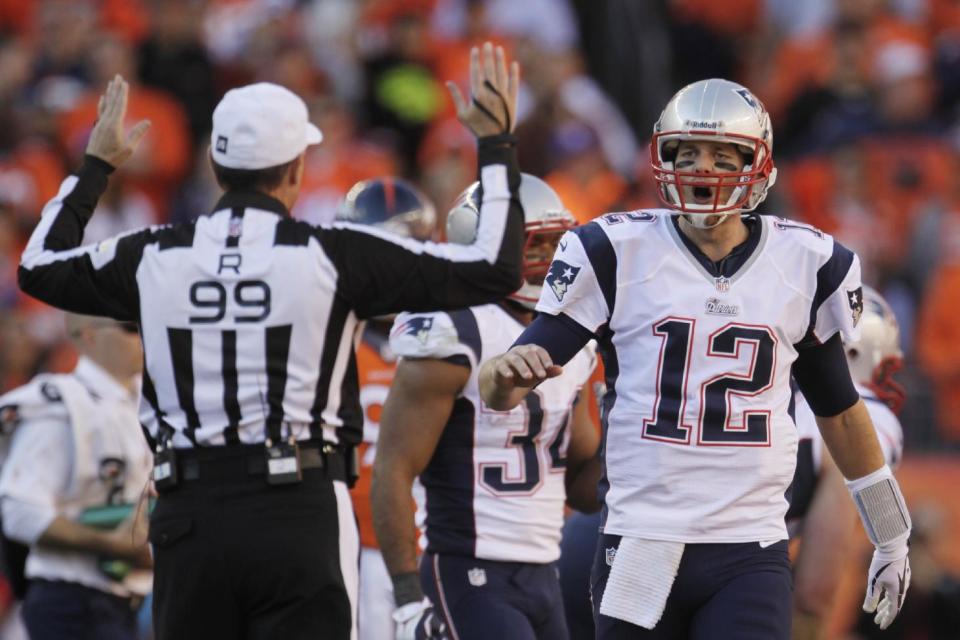 New England Patriots quarterback Tom Brady (12) reacts to a call by referee Tony Corrente during the second half of the AFC Championship NFL playoff football game against the Denver Broncos in Denver, Sunday, Jan. 19, 2014. (AP Photo/Joe Mahoney)