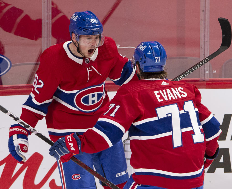 Montreal Canadiens' Artturi Lehkonen (62) celebrates with teammate Jake Evans (71) after scoring the tying goal during the third period of an NHL hockey game against the Edmonton Oilers, in Montreal, Monday, May 10, 2021. (Ryan Remiorz/The Canadian Press via AP)