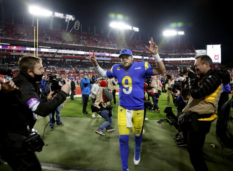 TAMPA BAY, FL- JANUARY 23, 2022: Los Angeles Rams quarterback Matthew Stafford (9) gives the victory sign.