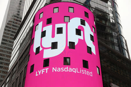 FILE PHOTO: Signage for Lyft is seen displayed at the NASDAQ MarketSite in Times Square in celebration of its initial public offering (IPO) on the NASDAQ Stock Market in New York, U.S., March 29, 2019. REUTERS/Shannon Stapleton/File Photo