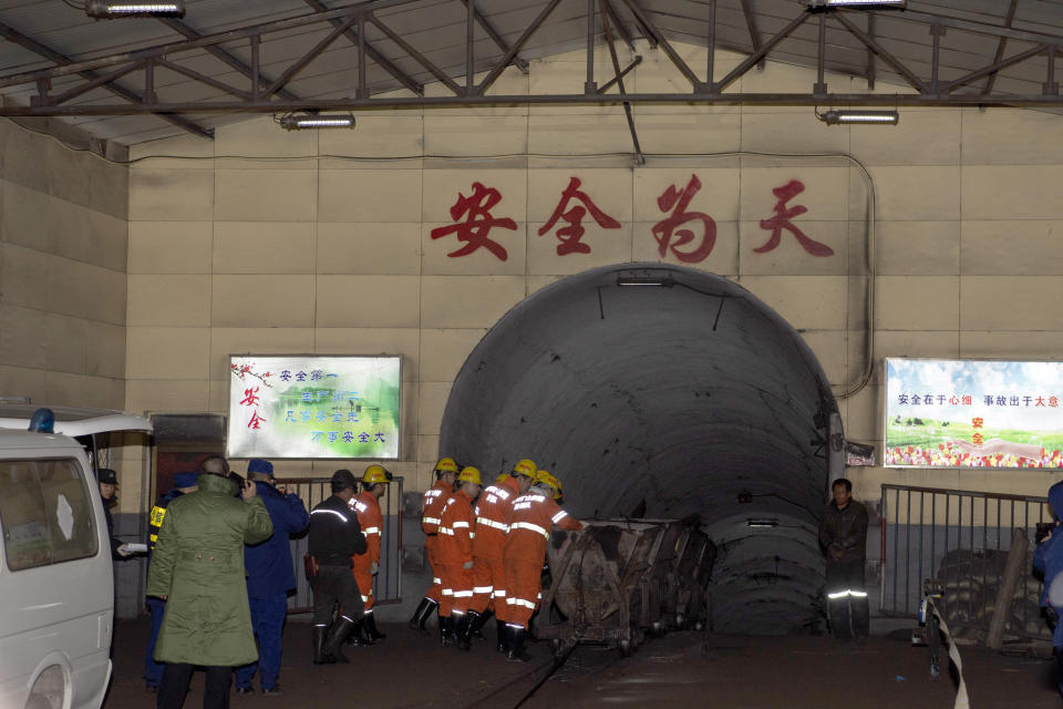 In this photo released by China's Xinhua News Agency, rescuers enter a coal mine that was the site of a gas explosion in Pingyao county in northern China's Shanxi Province, Tuesday, Nov. 19, 2019. Authorities in northern China say more than a dozen people were killed and others injured in a gas explosion inside a coal mine on Monday afternoon. (Yang Chenguang/Xinhua via AP)