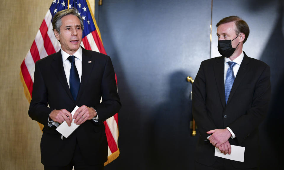 Secretary of State Antony Blinken, accompanied by National Security Adviser Jake Sullivan, right, talks to the media after a closed-door morning session of US-China talks in Anchorage, Alaska on Friday, March 19, 2021. (Frederic J. Brown/Pool via AP)