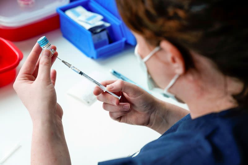 FILE PHOTO: The Pfizer COVID-19 vaccine is prepared by a healthcare worker in Melbourne