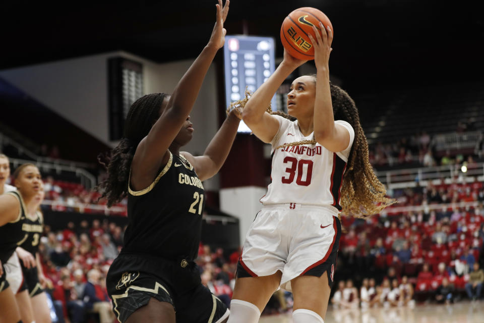 Stanford guard Haley Jones (30) shoots against Colorado center Aaronette Vonleh (21) during the first quarter of an NCAA college basketball game in Stanford, Calif., Sunday, Jan. 22, 2023. (AP Photo/Jim Gensheimer)