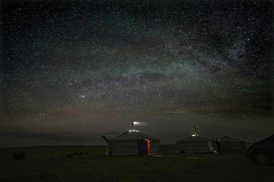 FILE- Stars light up the night sky over a ger, a portable, round tent insulated with sheepskin, in the remote Munkh-Khaan region of the Sukhbaatar district, in southeast Mongolia, Tuesday, May 16, 2023. (AP Photo/Manish Swarup, File)