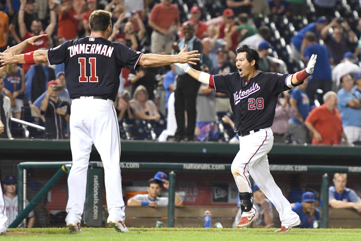 Kurt Suzuki #28 of the Washington Nationals celebrates a walk off home run in the ninth inning with Ryan Zimmerman #11 during a baseball game against the New York Mets at Nationals Park on September 3, 2019 in Washington, DC. (Photo by Mitchell Layton/Getty Images)