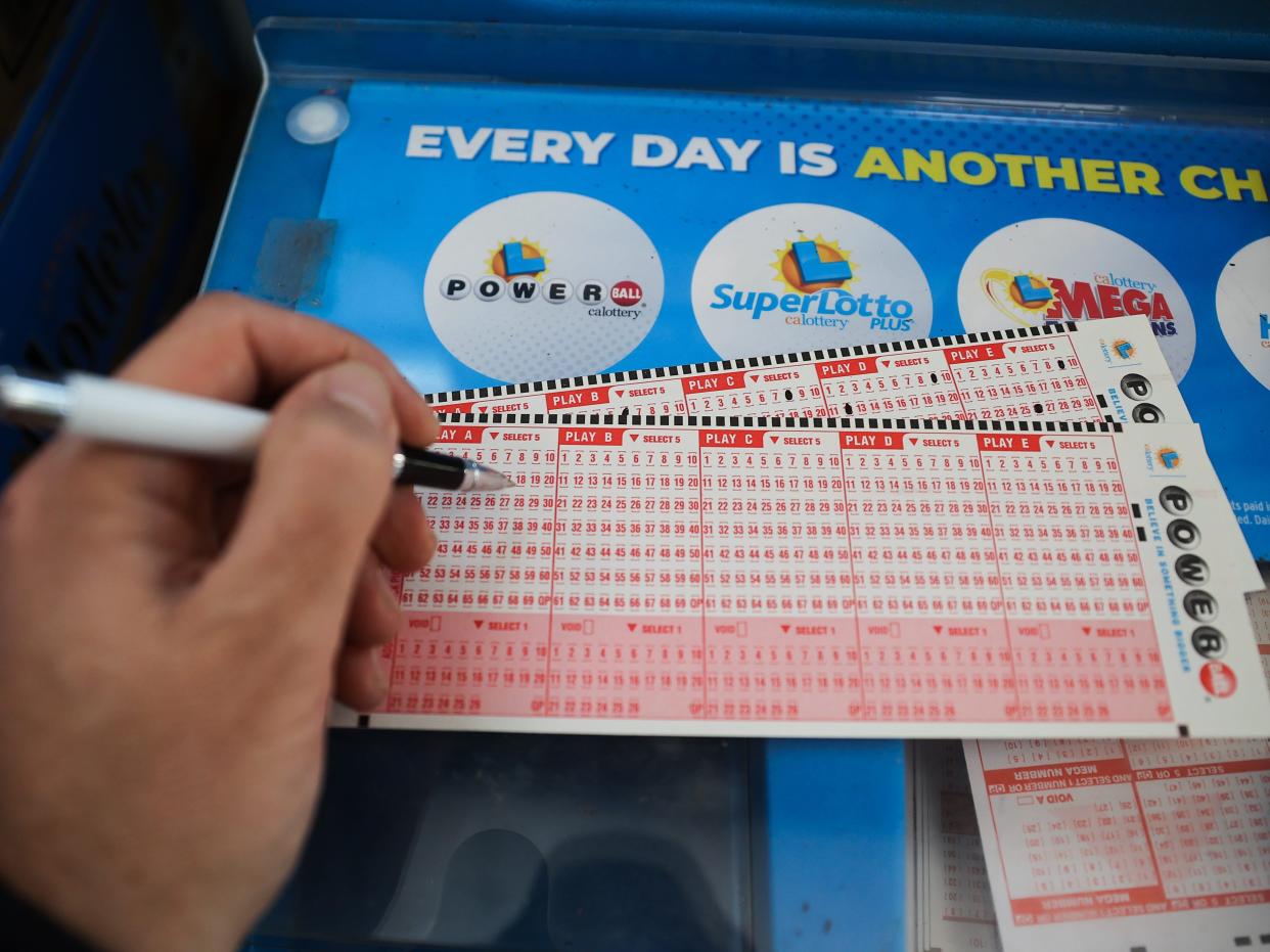 A person plays Powerball lottery at a 7-Eleven store in Milpitas, California, United States on November 7, 2022.