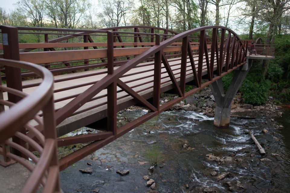 A large bridge stretches over Lake Fayetteville as part of 37.5-mile Razorback Regional Greenway through northwest Arkansas.