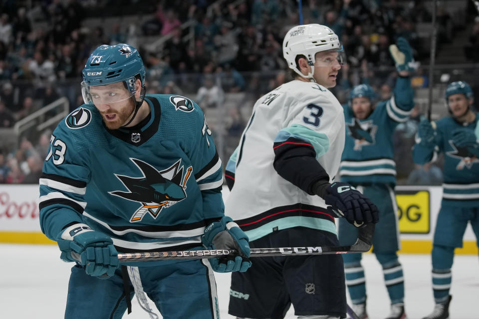 San Jose Sharks center Noah Gregor, left, reacts after scoring next to Seattle Kraken defenseman Will Borgen (3) during the second period of an NHL hockey game in San Jose, Calif., Monday, Feb. 20, 2023. (AP Photo/Jeff Chiu)