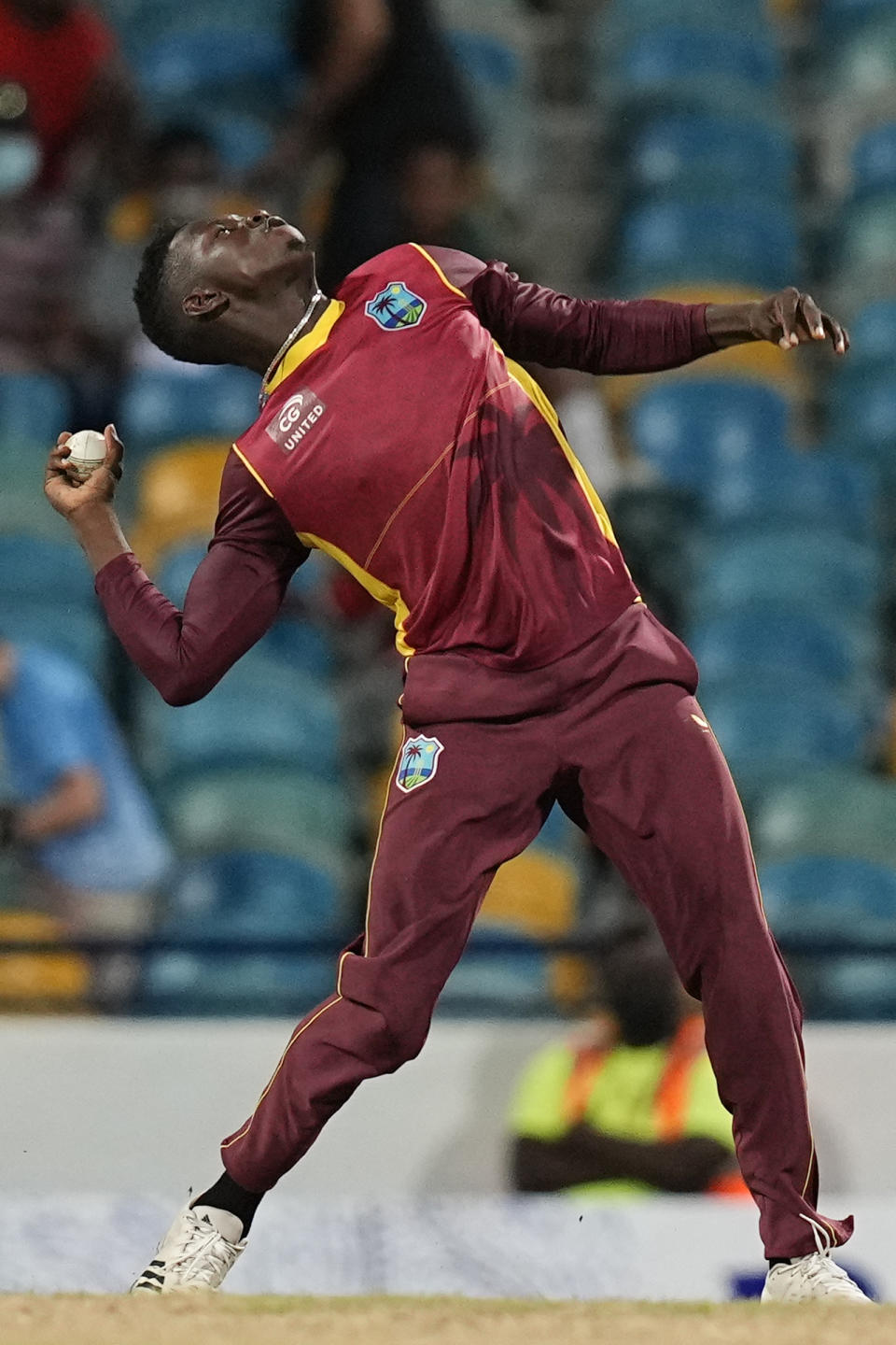 West Indies' Kevin Sinclair celebrates taking the catch from his own bowling to dismiss New Zealand's Trent Boult during the second ODI at Kensington Oval in Bridgetown, Barbados, Friday, Aug. 19, 2022. (AP Photo/Ramon Espinosa)