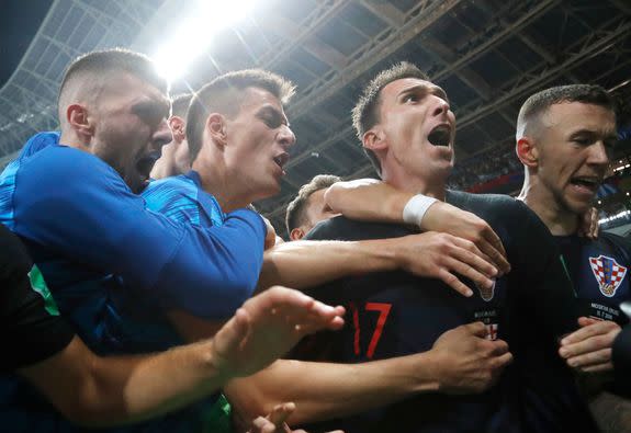 Mandatory Credit: Photo by Frank Augstein/AP/REX/Shutterstock (9757294ci) Croatia's Mario Mandzukic, second right, celebrates after scoring his side's second goal during the semifinal match between Croatia and England at the 2018 soccer World Cup in the Luzhniki Stadium in Moscow, Russia Russia Soccer WCup Croatia England, Moscow, Russian Federation - 11 Jul 2018