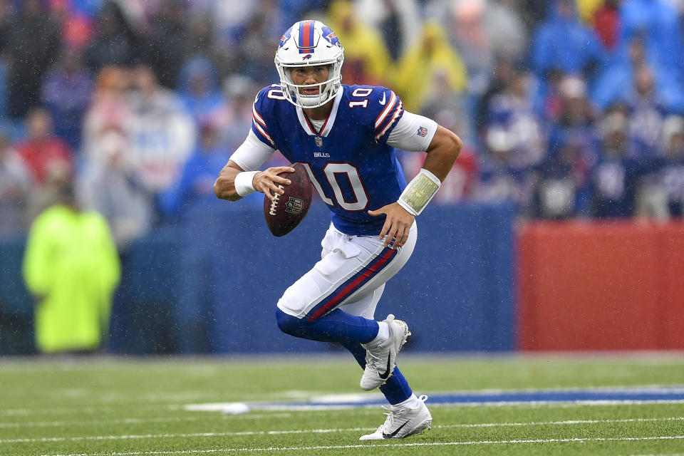 FILE - Buffalo Bills quarterback Mitchell Trubisky runs with the ball during the second half of an NFL football game against the Houston Texans, Sunday, Oct. 3, 2021, in Orchard Park, N.Y. Trubisky is returning to Buffalo to reprise his roll as Josh Allen's backup after signing a two-year contract with the Bills on Thursday, March 7, 2024. (AP Photo/Adrian Kraus, File)