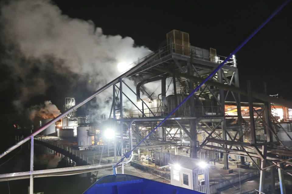 Steam rises from Omega Protein's menhaden processing plant on Cockrell's Creek in Reedville, Va., Tuesday, Nov. 26, 2019. The last east coast fishery now produces fish oil for health supplements and faces a possible moratorium over concerns about overfishing in the Chesapeake Bay. (AP Photo/Steve Helber)