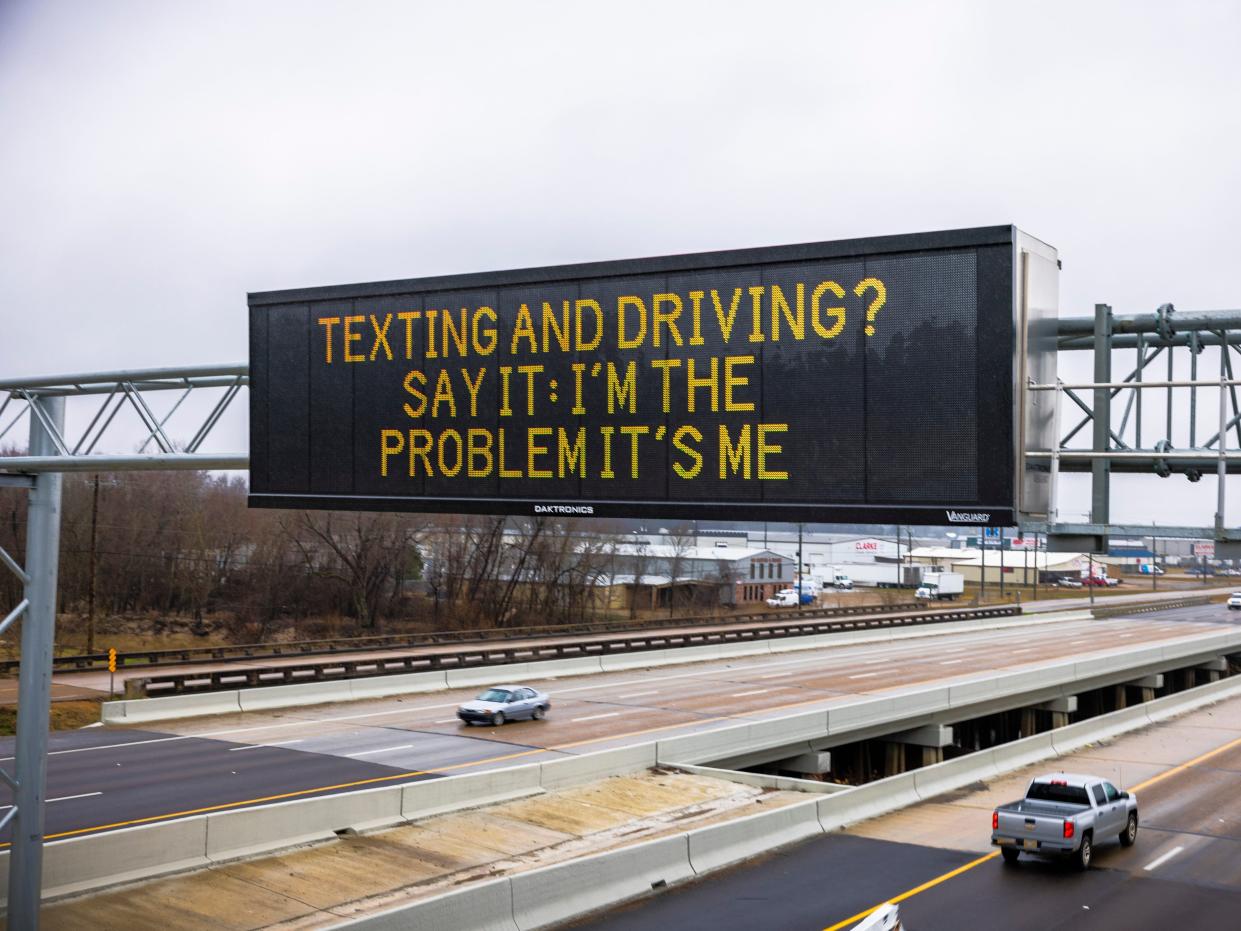A roadside safety sign in Mississippi reading "Texting and driving? Say it: I'm the problem it's me."