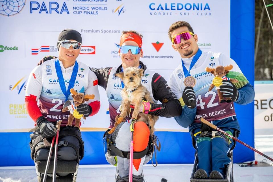 Zaplotinsky, centre, poses on the podium alongside Mengtao, left, and Westemaier Ribeira.