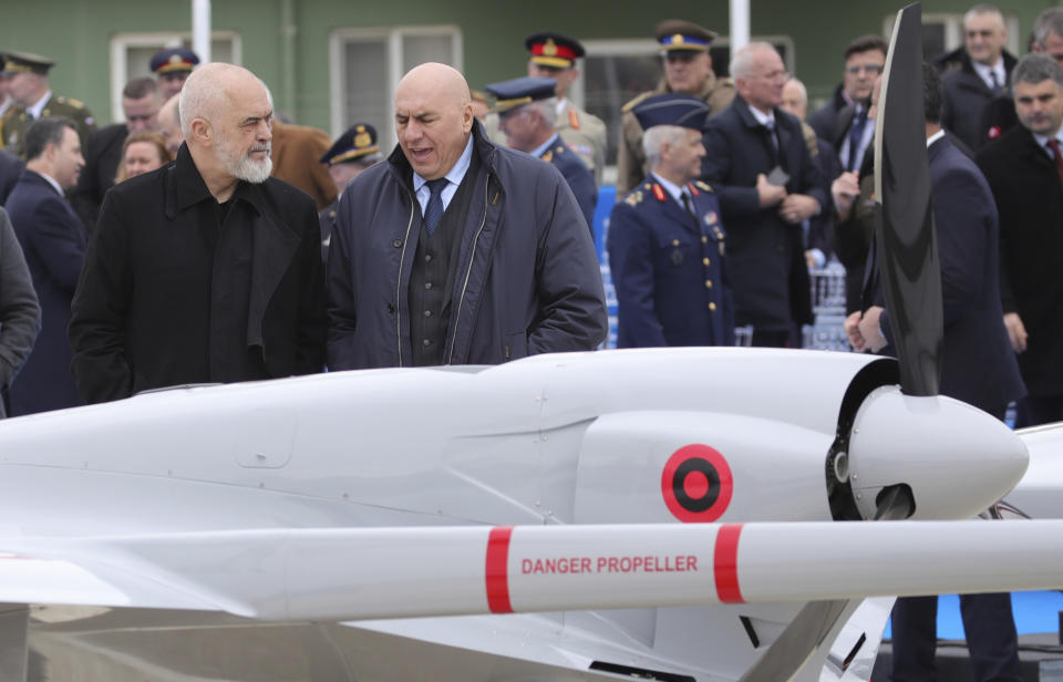 Albania's Prime Minister Edi Rama, left, and Italy's Defence Minister Guido Crosetto attend an inauguration ceremony at an airbase in Kocuve, about 85 kilometers (52 miles) south of Tirana, Albania, Monday, March 4, 2024. NATO member Albania inaugurated an international tactic air base on Monday, the Alliance's first one in the Western Balkan region. (AP Photo/Armando Babani)
