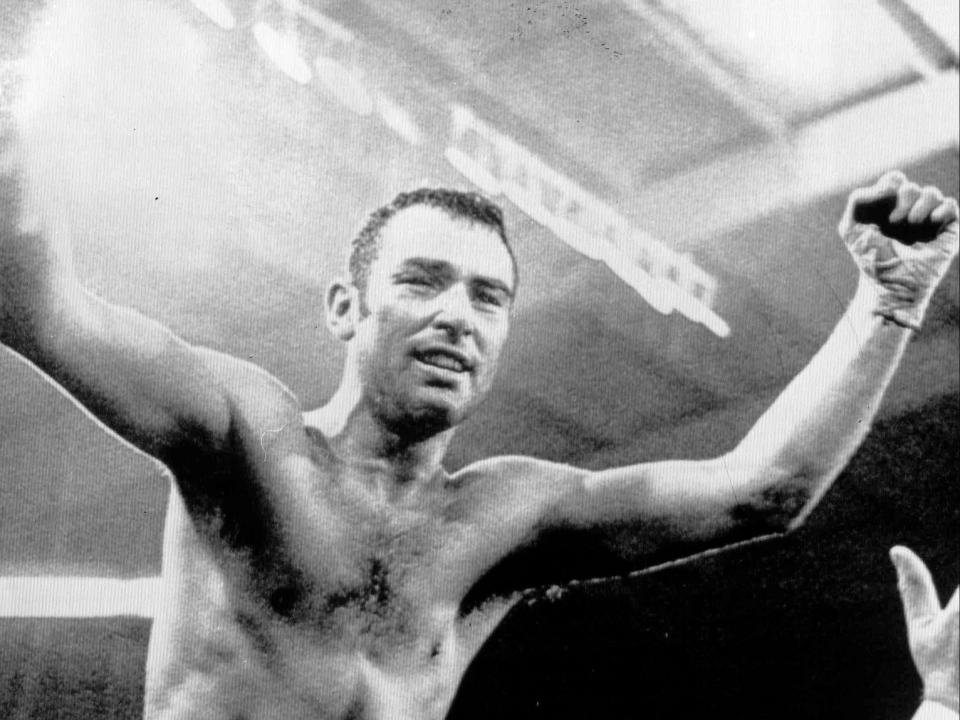 Alan Minter celebrates winning the world title after victory over Vito Antuofermo (AP)