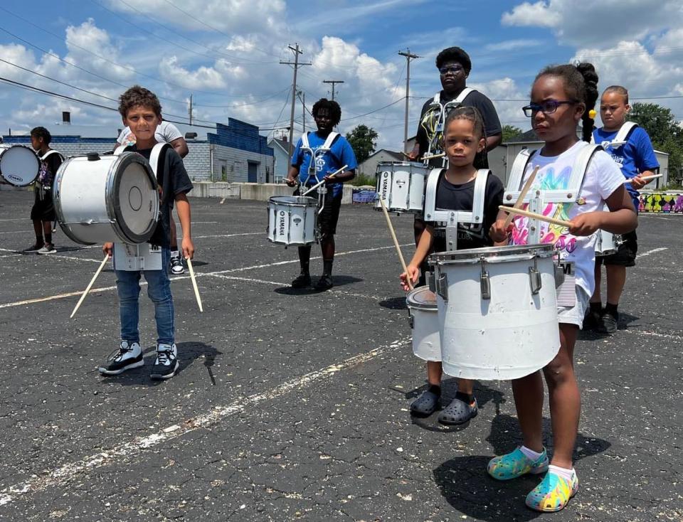 Children practice the drumline at a summer camp this year at the EN-RICH-MENT Fine Arts Academy in Canton.