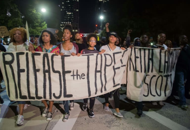 Protesters march in Charlotte, North Carolina, calling for the release of a police tape of the shooting of Keith Lamont Scott