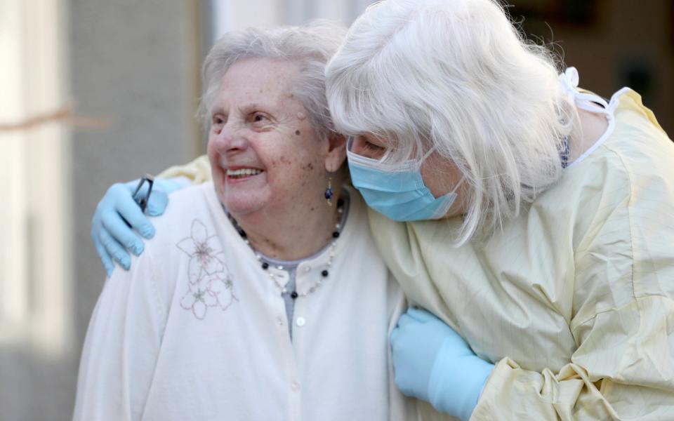 Fiona Scott visits her mother Mary Cook at a nursing home for the first time since the lockdown started in Scotland - Pool