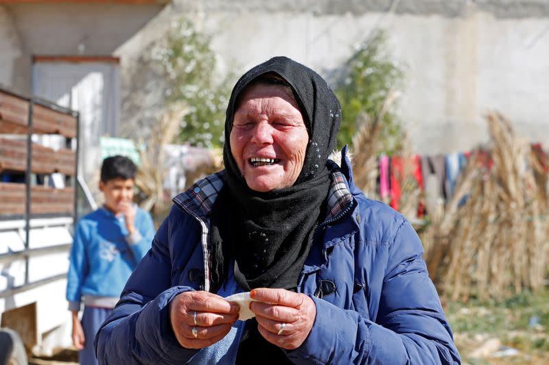 Gamra, the mother of Brahim Aouissaoui, who is suspected of carrying out Thursday's attack in Nice, France, reacts at her home in Thina, a suburb of Sfax, Tunisia