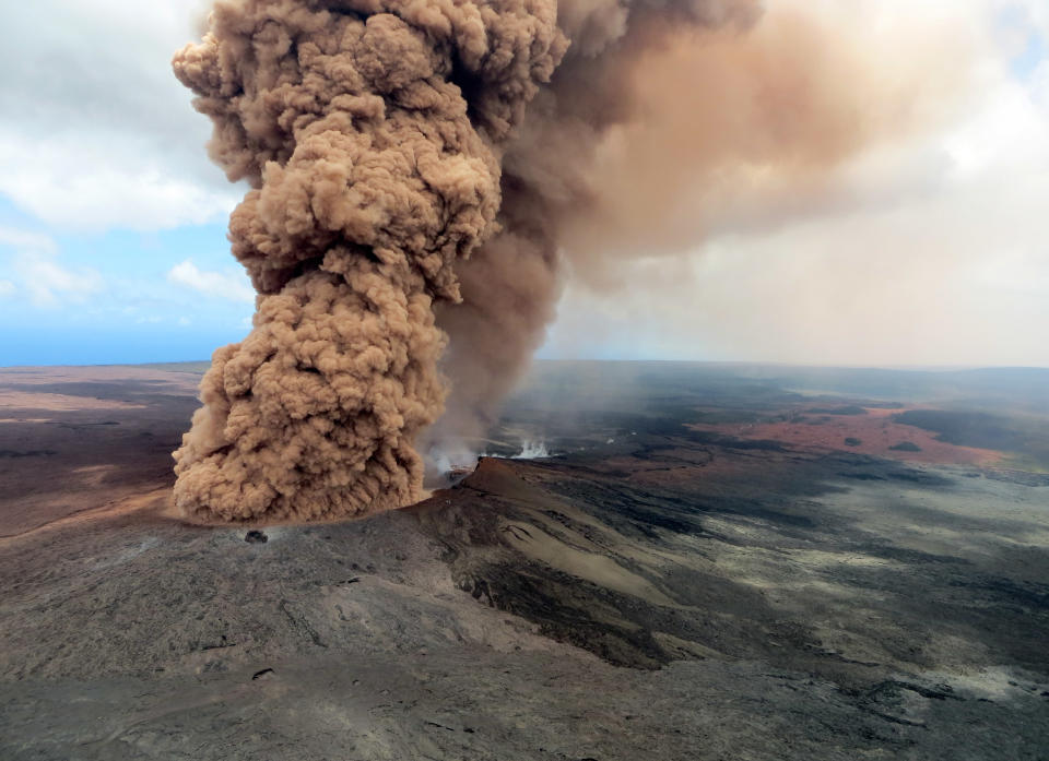 A&nbsp;column of robust, reddish-brown ash plume looms over the Big Island on Friday.&nbsp;