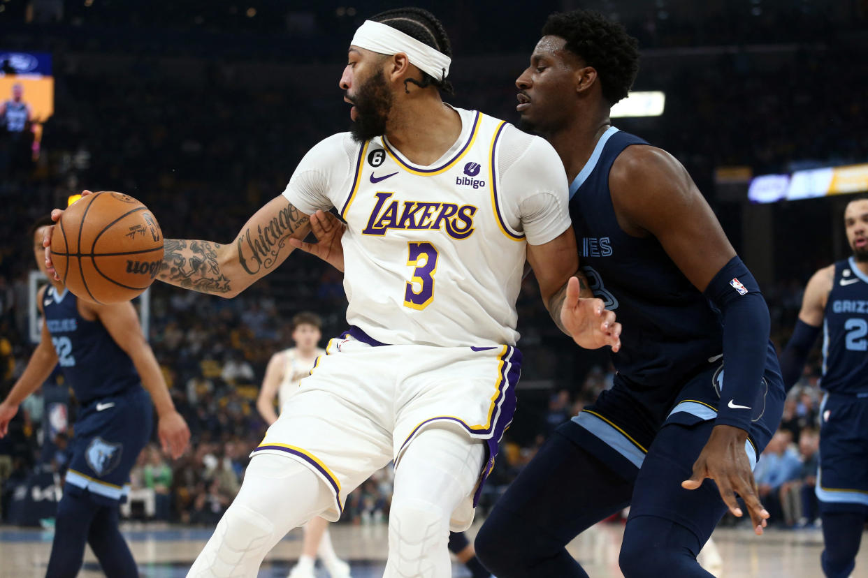 Apr 16, 2023; Memphis, Tennessee, USA; Los Angeles Lakers forward Anthony Davis (3) spins toward the basket as Memphis Grizzlies forward Jaren Jackson Jr. (13) defends during the first half during game one of the 2023 NBA playoffs at FedExForum. Mandatory Credit: Petre Thomas-USA TODAY Sports
