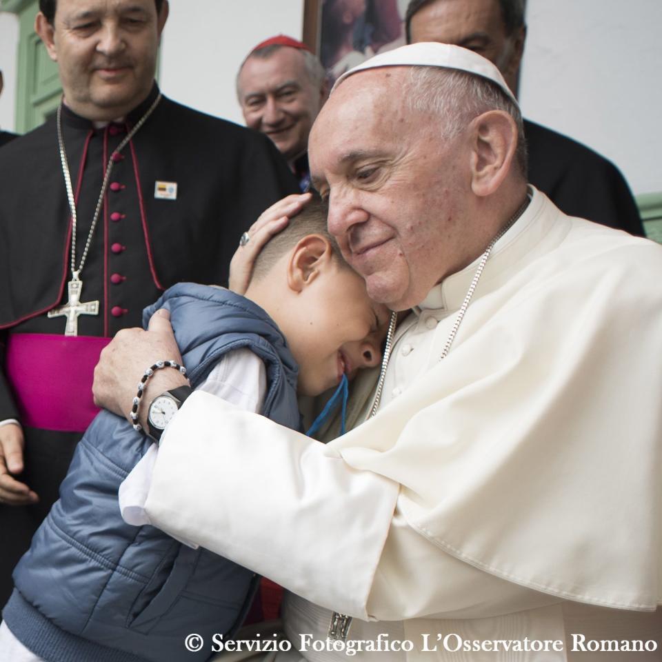 Pope Francis hugs a child during his visit to “Hogar San José” children’s home in Medellin, Colombia, Saturday, Sept. 9, 2017. (L’Osservatore Romano/Pool Photo via AP)