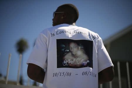 Lavell Ford wears a T-shirt protesting the fatal police shooting of his brother Ezell Ford, who died during an August 11, 2014 confrontation with police in South Los Angeles, at a rally in Los Angeles, California August 15, 2014. REUTERS/Lucy Nicholson