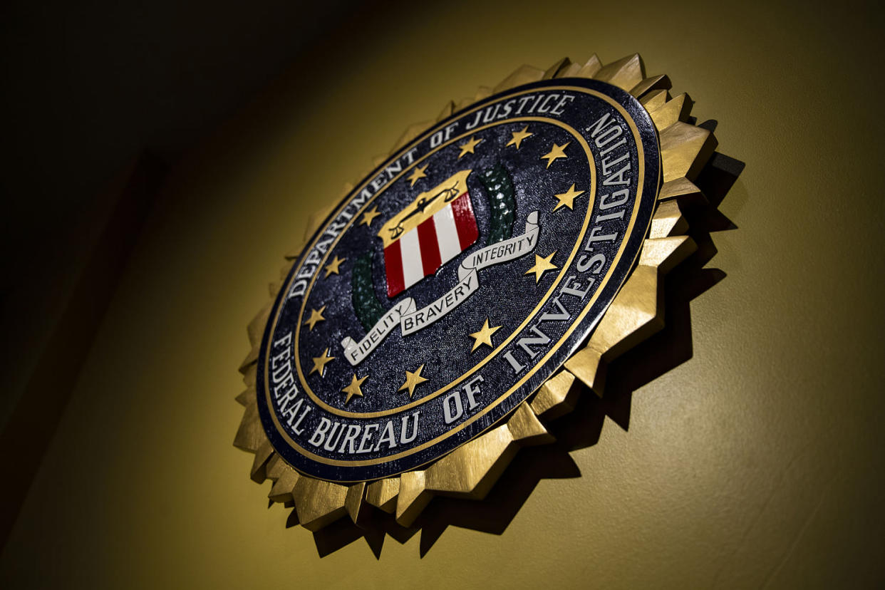 Image: The seal of the Federal Bureau of Investigation hangs on a wall  at the FBI headquarters in Washington on June 14, 2018. (Al Drago / Bloomberg via Getty Images file)