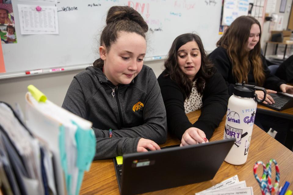 Teacher Shelby Shull helps Sixth Grader Sophia Brown with her writing, on Wednesday, Feb. 16, 2022, at Cardinal Middle School, in Eldon. 