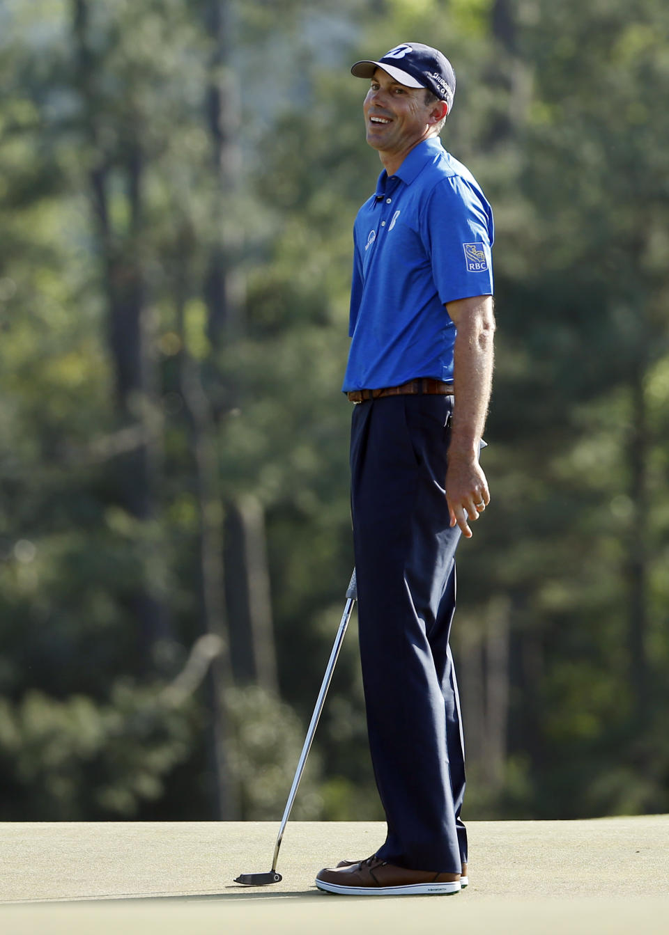 Matt Kuchar reacts to a missed putt on the 18th green during the third round of the Masters golf tournament Saturday, April 12, 2014, in Augusta, Ga. (AP Photo/Matt Slocum)