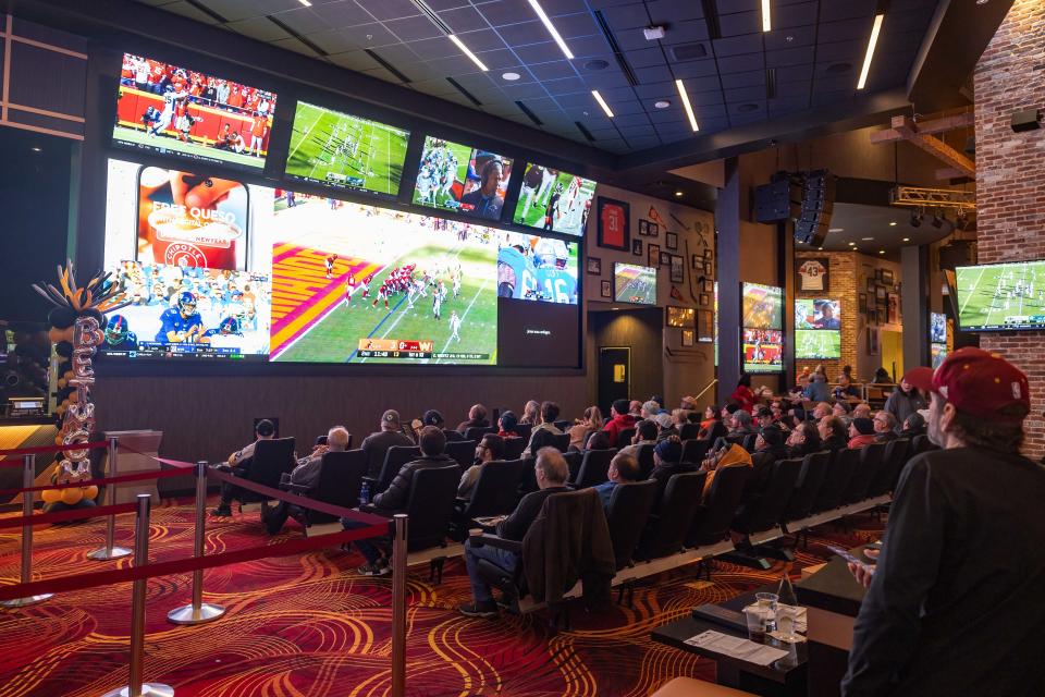 A crowd gathers in MGM Northfield Park’s BetMGM lounge to watch and bet on the Cleveland Browns game against the Washington Commanders.