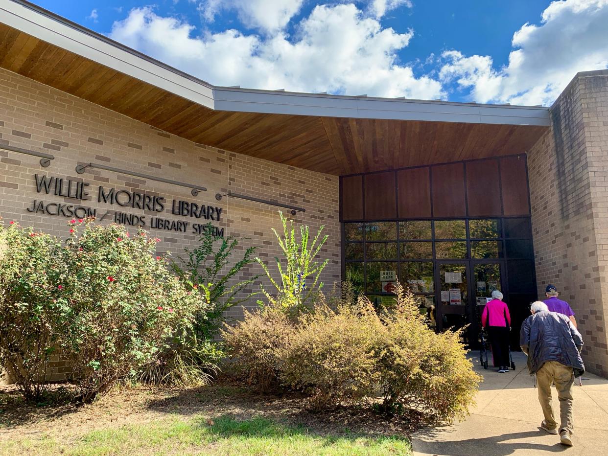 Voters make their way into Willie Morris Library for Tuesday’s election in Jackson, Miss.