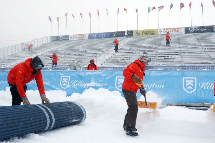 Killington World Cup crew shovel snow