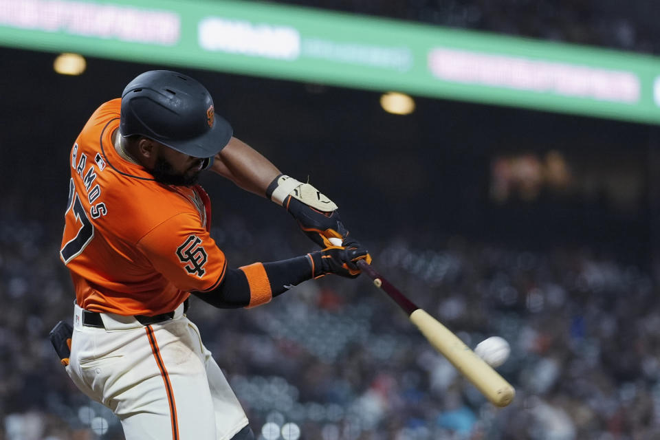 San Francisco Giants' Heliot Ramos hits a three-run home run against the Los Angeles Angels during the eighth inning of a baseball game Friday, June 14, 2024, in San Francisco. (AP Photo/Godofredo A. Vásquez)