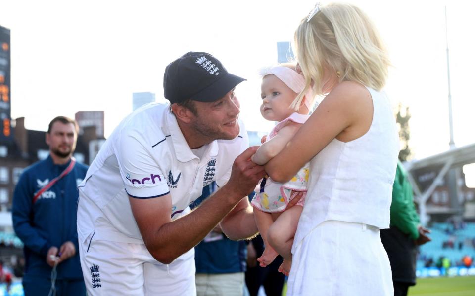 Stuart Broad of England interacts with Partner Mollie King and their daughter