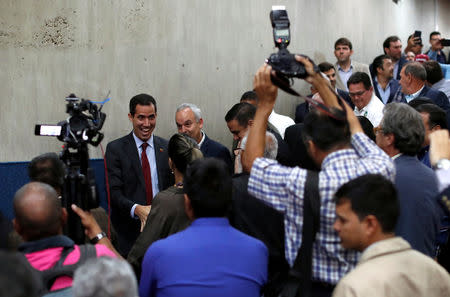 Venezuelan opposition leader Juan Guaido arrives to attend a meeting with representatives of FEDEAGRO, the Confederation of Associations of Agricultural Producers of Venezuela, in Caracas, Venezuela February 6, 2019. REUTERS/Carlos Garcia Rawlins