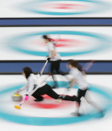 Curling - Pyeongchang 2018 Winter Olympics - Women's Round Robin - Switzerland v Japan - Gangneung Curling Center - Gangneung, South Korea - February 21, 2018 - Skip Satsuki Fujisawa of Japan delivers the stone. REUTERS/Lucy Nicholson