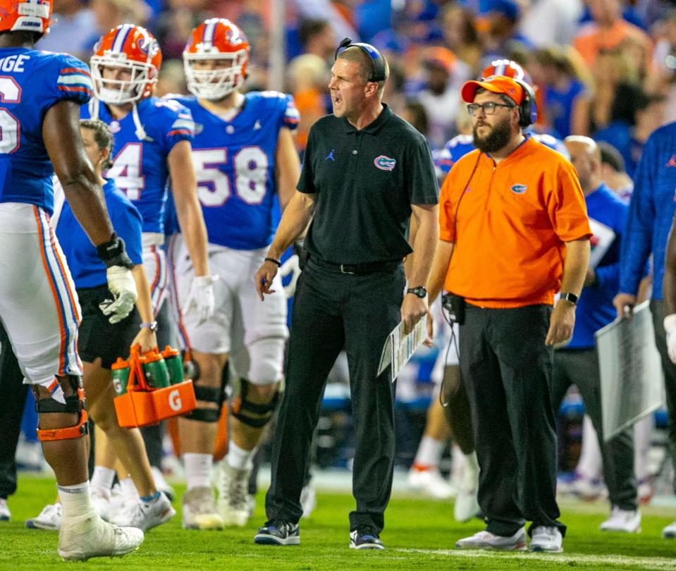 After the Florida Gators went 6-7 last season and face quarterback uncertainty in 2023, the rebuild for head coach Billy Napier (center), seen here in last year's game against LSU, may take longer than initially expected.