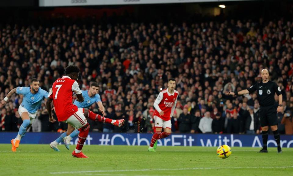 Bukayo Saka scores a penalty for Arsenal against Manchester City