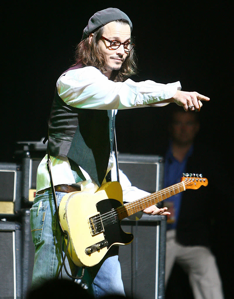 <b>13. And has appeared in multiple music videos:</b> Depp, who released the album "P" in 1995 with his eponymous band — that included Red Hot Chili Peppers bassist Flea — has popped up in videos for Tom Petty and the Lemonheads.