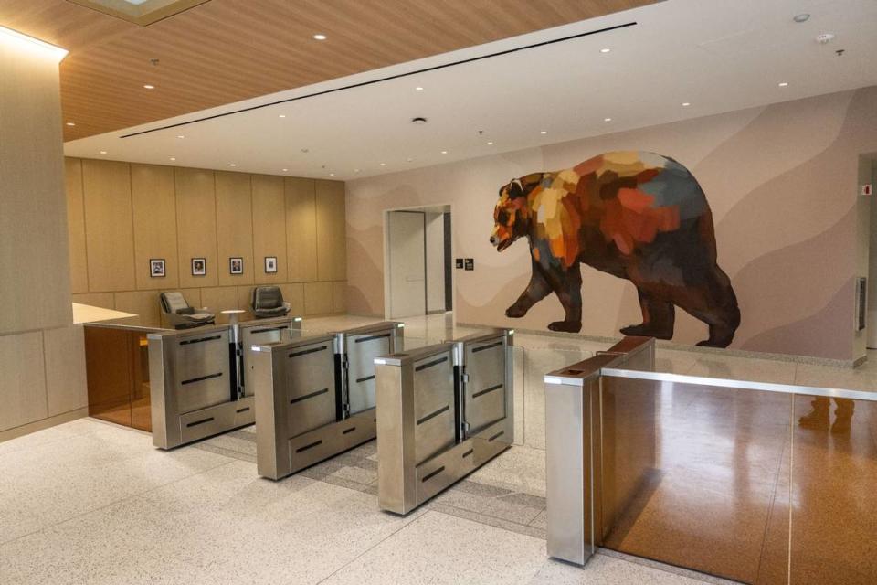 A lobby in the May S. Lee State Office Complex is decorated with the state bear.