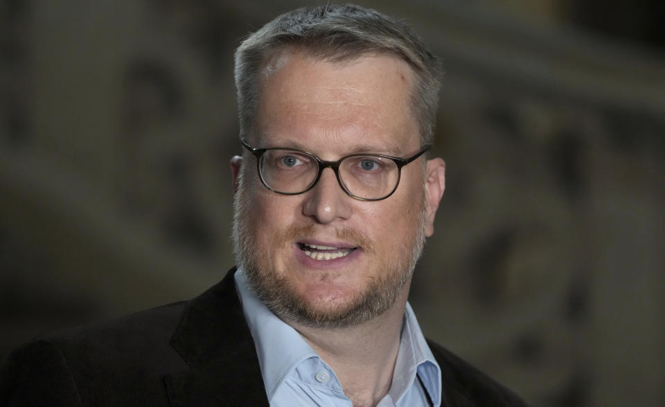 Sebastian Buechner, spokesman of Berlin's public prosecutor's office, addresses the media during a statement in Berlin, Germany, Thursday, June 9, 2022 on a 29-year-old man, who drove his car into a group of students in Berlin killing their teacher and crash into a store on Wednesday, June 8, 2022. (AP Photo/Michael Sohn)