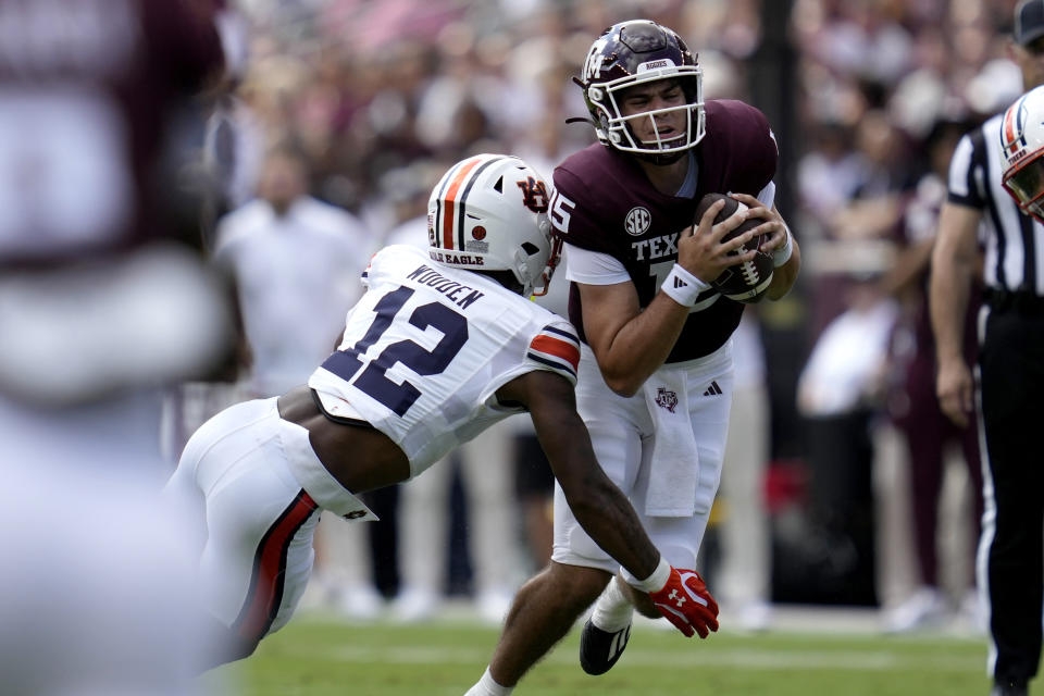 Auburn safety Caleb Wooden (12) sacks Texas A&M quarterback Conner Weigman (15) for a loss during the first quarter of an NCAA college football game Saturday, Sept. 23, 2023, in College Station, Texas. (AP Photo/Sam Craft)